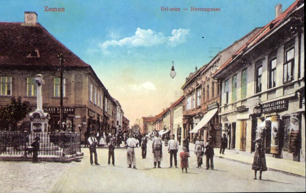 Kolorisana razglednica Gospodske ulice u Zemunu oko 1900, sa prolaznicima